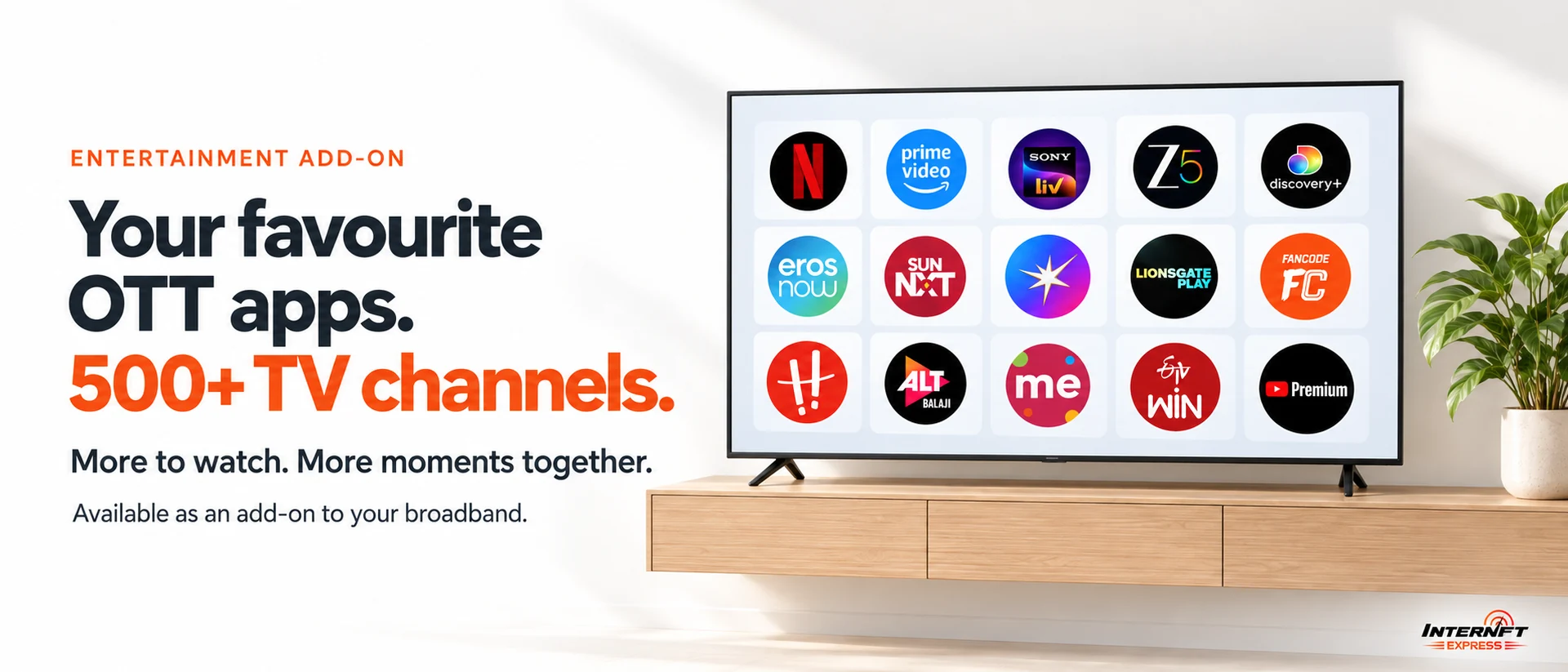 A television on a wooden console showing a grid of OTT app icons including Netflix, Prime Video, SonyLIV, ZEE5, discovery+, Eros Now, Sun NXT, Lionsgate Play, FanCode, ALTBalaji and YouTube Premium. Caption: entertainment add-on — your favourite OTT apps and 500+ TV channels, available as an add-on to your broadband.