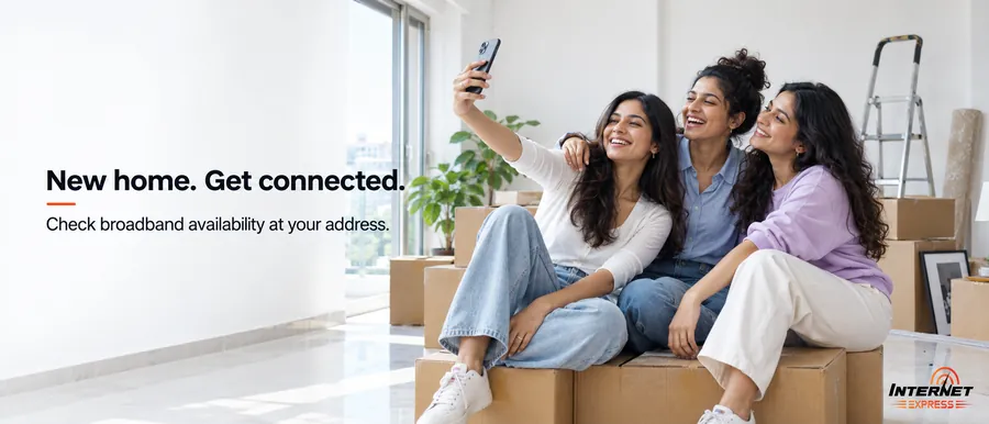 Brand illustration of a family sitting among moving boxes in a new living room, captioned New home, get connected, check broadband availability at your address.